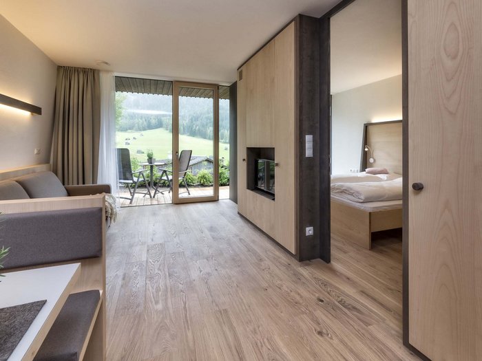 Nature-filled experiences at the Villa Rainer Modern hotel room with balcony and mountain view
