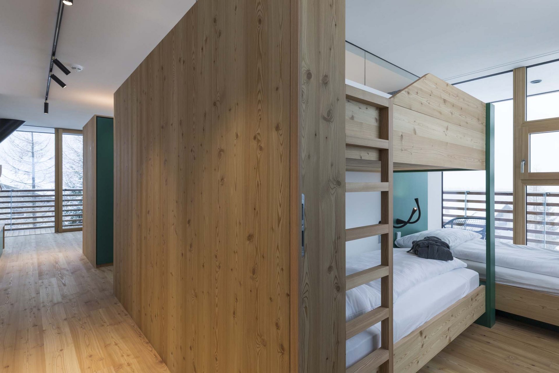 Stylish holidays at the Residence Paramount Alma Hallway and bedroom with light wood bunk bed and large window