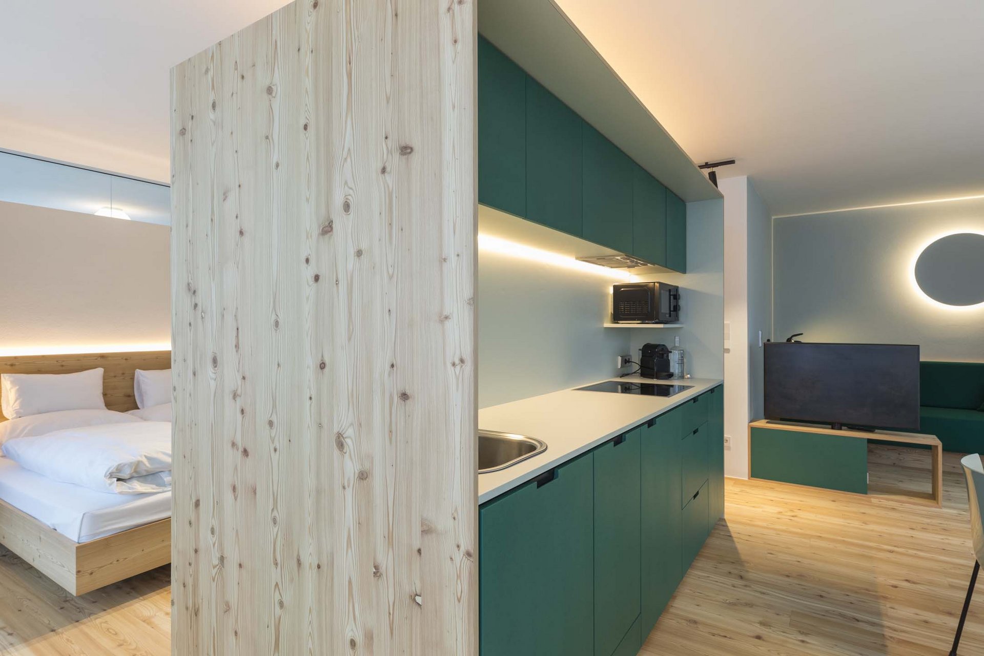 Stylish holidays at the Residence Paramount Alma Modern studio with kitchenette, bedroom area, and seating space with TV