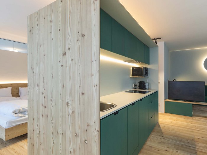 Stylish holidays at the Residence Paramount Alma Modern studio with kitchenette, bedroom area, and seating space with TV